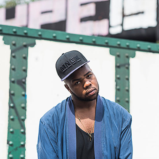 Slide 1:A British artist MNEK wearing a 9FIFTY snapback designed with New Era Cap