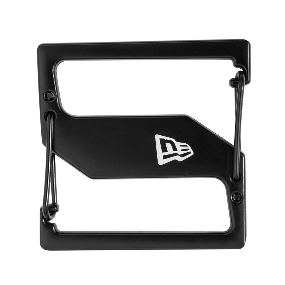 New Era Black Cap Clip, close-up showing a black rectangular design with the white New Era flag logo centred on one side, featuring a secure clip mechanism on the right edge with bolt detailing.