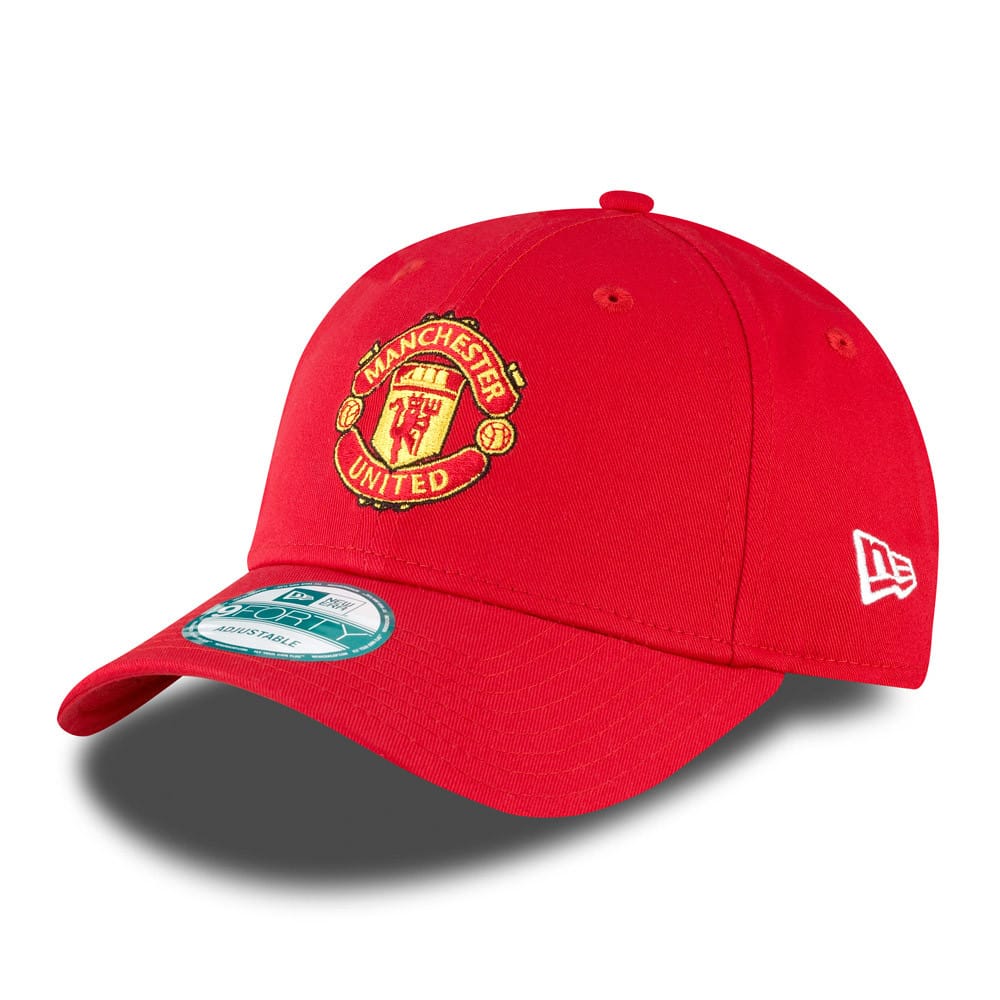 Manchester United Essential Red New Era 9FORTY Cap, three-quarter view showing the embroidered club crest on the front panel, curved visor with a 9FORTY size sticker, and New Era flag logo on the left side.