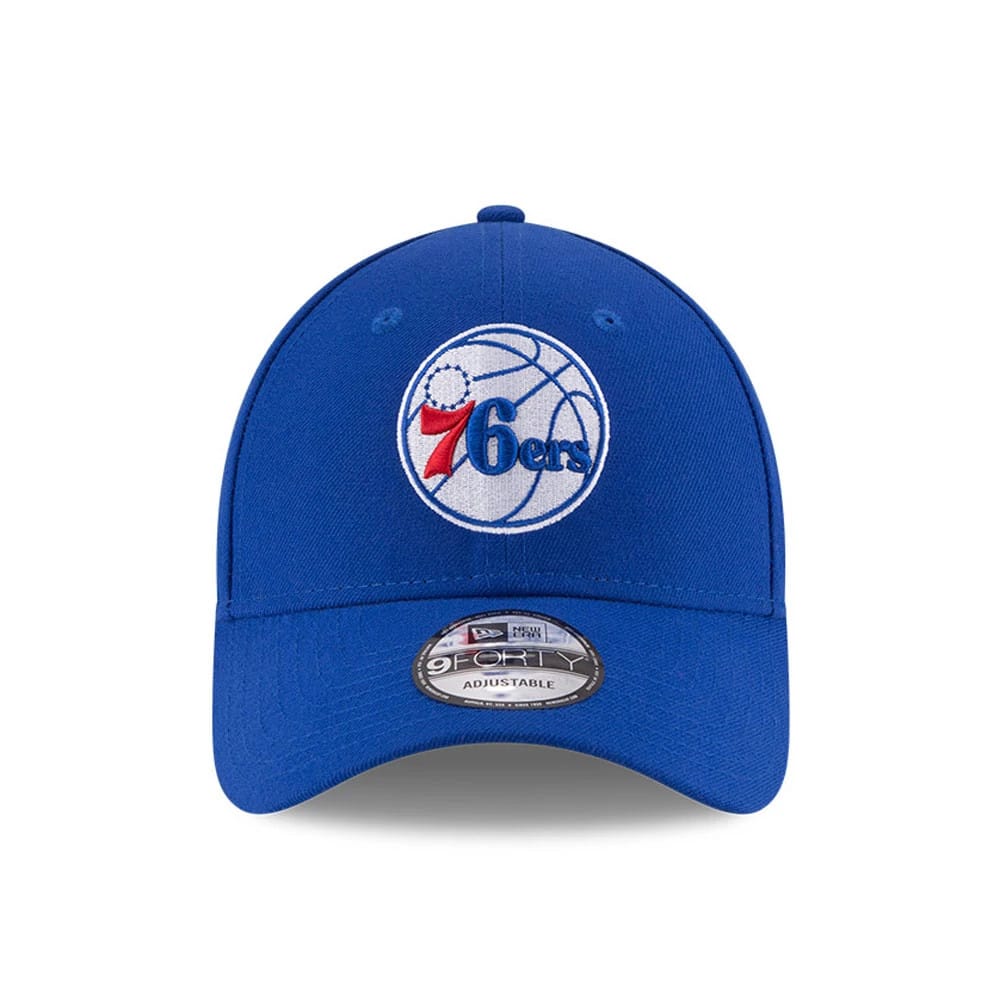 Philadelphia 76ers The League Blue New Era 9FORTY Cap, front view showing the raised embroidered team logo on the structured crown, blue visor with a 9FORTY size sticker, and matching top button with eyelets.