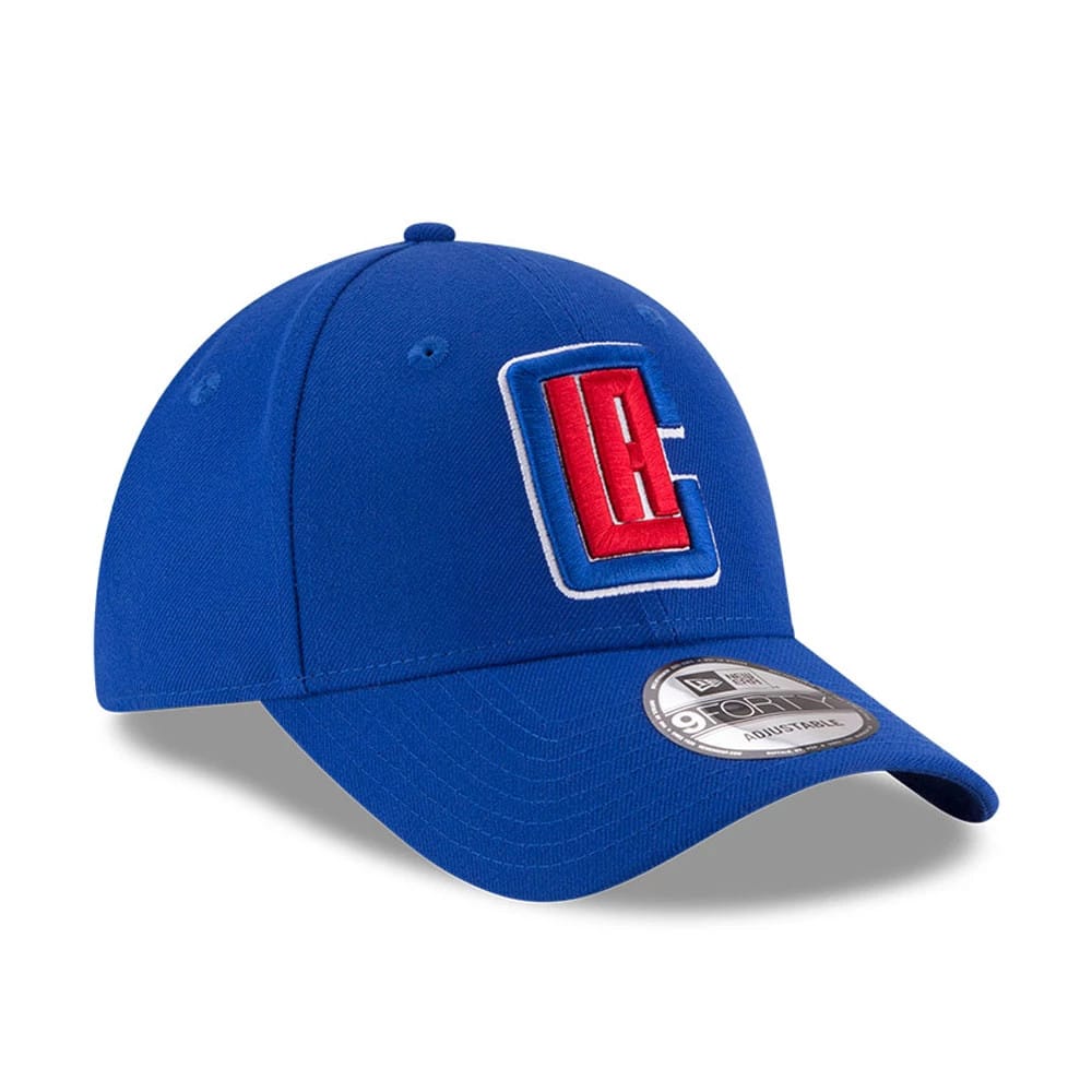 LA Clippers The League Blue New Era 9FORTY Cap, three-quarter view showing the raised red and white LA logo on the structured blue front panels, curved blue visor with 9FORTY size sticker, and top button.