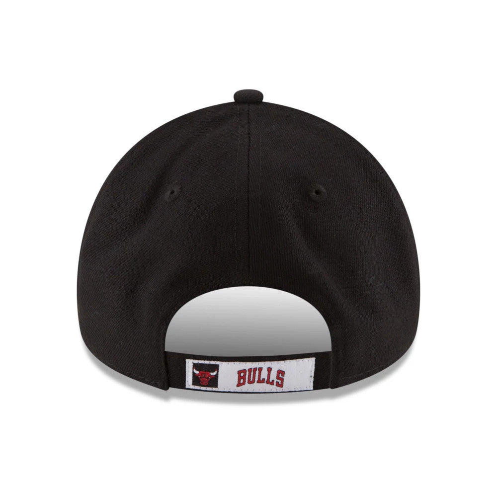 Chicago Bulls The League Black New Era 9FORTY Cap, rear view showing the embroidered Bulls logo and red BULLS text on a white strap, beneath the black structured crown with a curved opening.