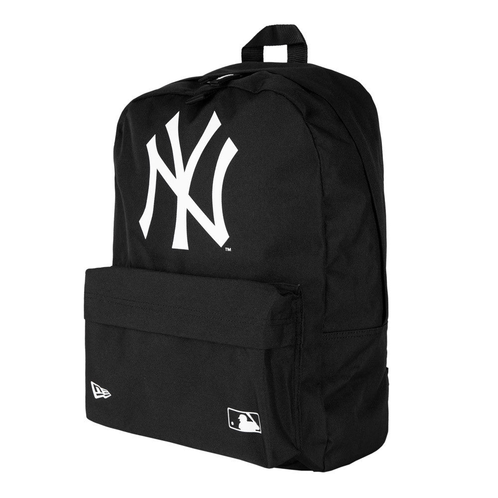 New York Yankees Black Stadium Backpack, three-quarter view showing a large white embossed Yankees logo on the upper front, a small white New Era logo on the pocket, and a carry handle on top.