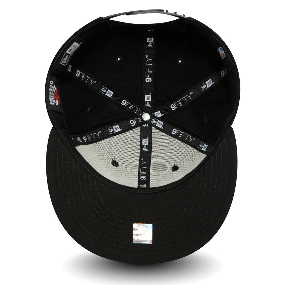Chicago Bulls Logo Black New Era 9FIFTY Cap, inside view showing black taping with white branding, a grey undervisor, black sweatband, and a 9FIFTY size sticker on the underside of the flat visor.