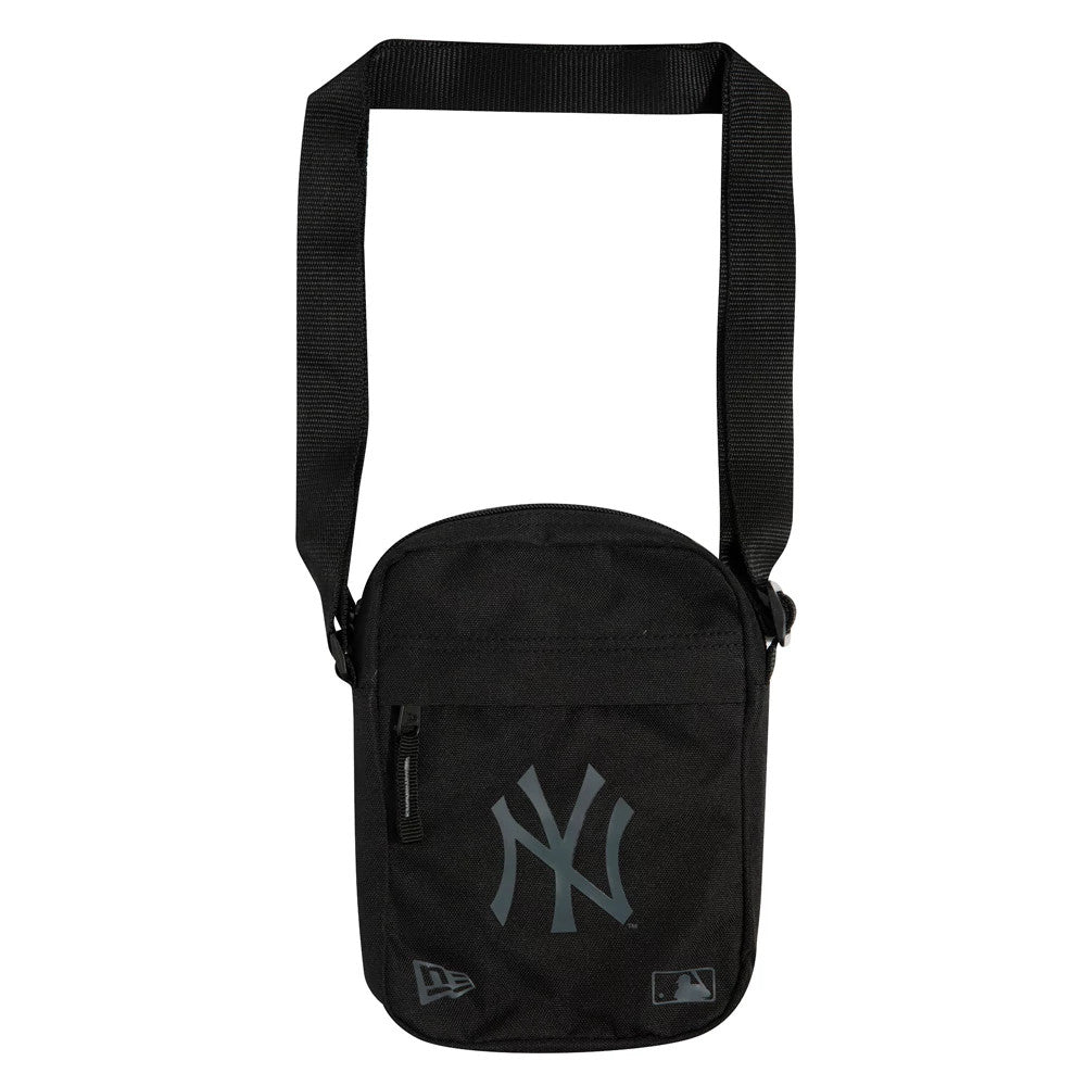 New York Yankees Logo Black Side Bag, front view showing a black rectangular bag with a grey debossed Yankees logo centred on the front pocket, a zip on the upper left, and a long adjustable strap attached at both sides.