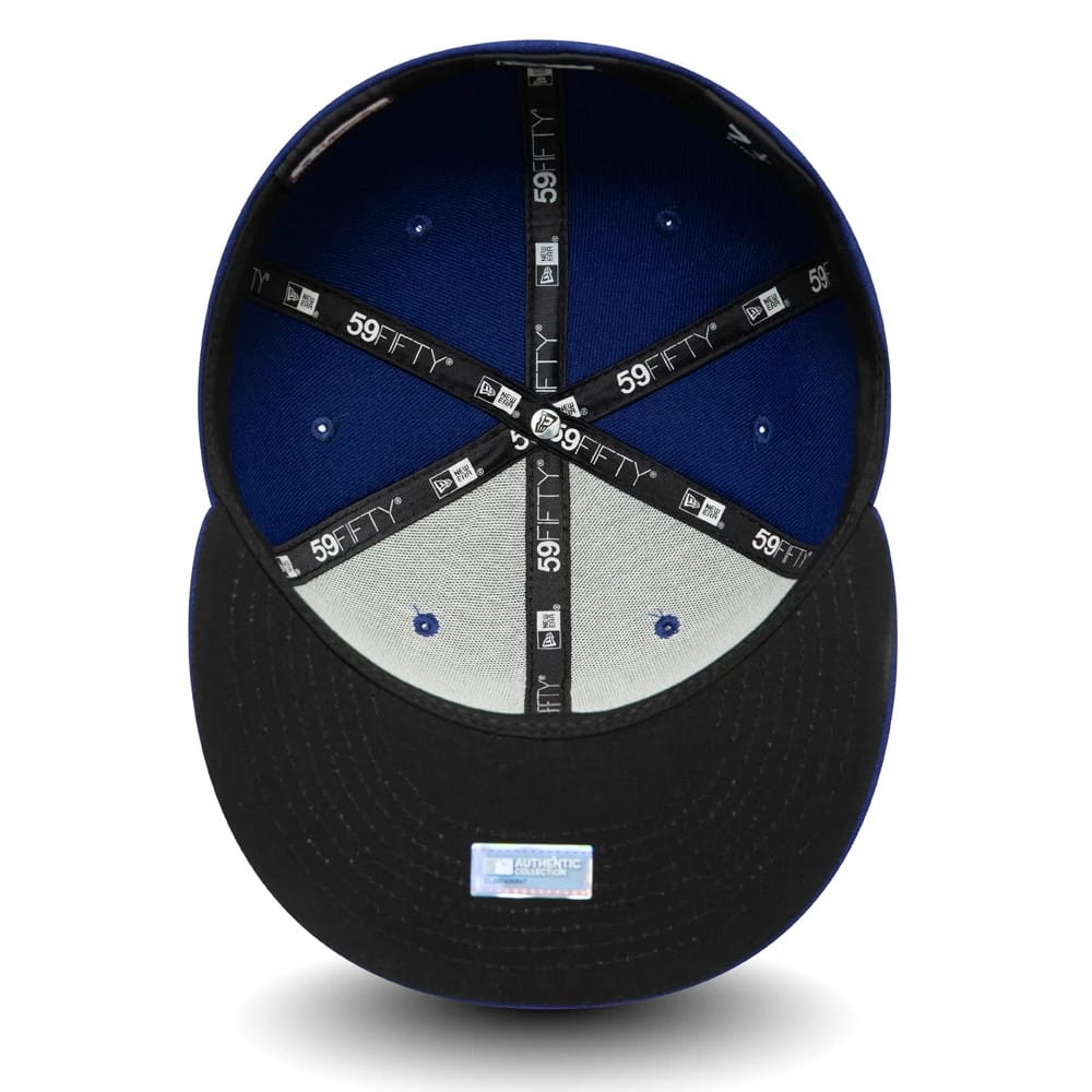 Texas Rangers MLB AC Perf Dark Blue New Era 59FIFTY Fitted Cap, inside view showing black taping with 59FIFTY branding, a black sweatband, and a blue MLB Authentic Collection sticker on the undervisor.