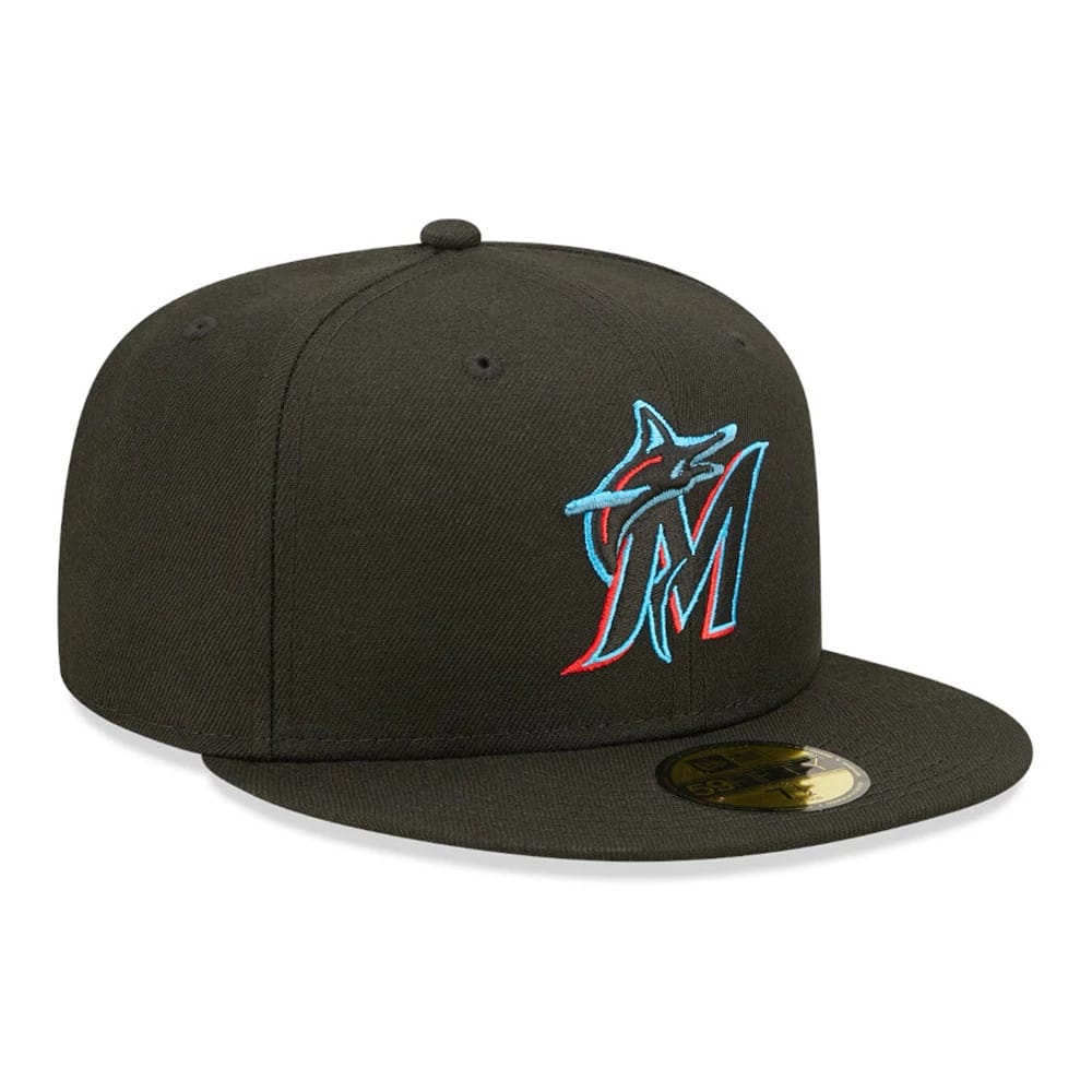 Miami Marlins Authentic On Field Game Black New Era 59FIFTY Fitted Cap, three-quarter view showing the raised teal and red embroidered Marlins logo on the front panel, flat black visor and gold 59FIFTY size sticker on top.