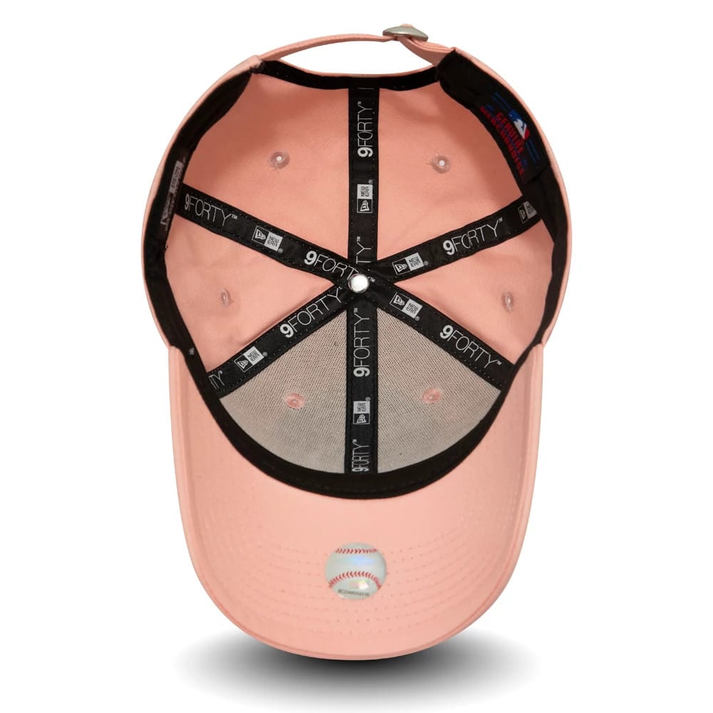 New York Yankees Kids Pink New Era 9FORTY Cap, inside view showing black taping with 9FORTY branding, a grey undervisor, and a top button, along with a baseball emblem embroidered on the pink undervisor.