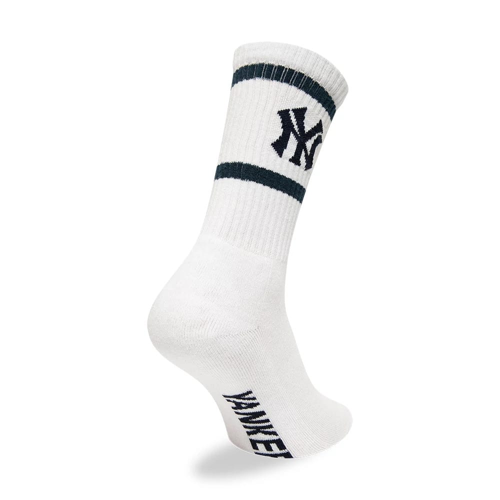 New York Yankees MLB Premium White Socks, side view showing the ribbed cuff with two dark stripes, the black embroidered NY logo on the side of the cuff, and the text "YANKEES" running vertically at the back of the white sock.