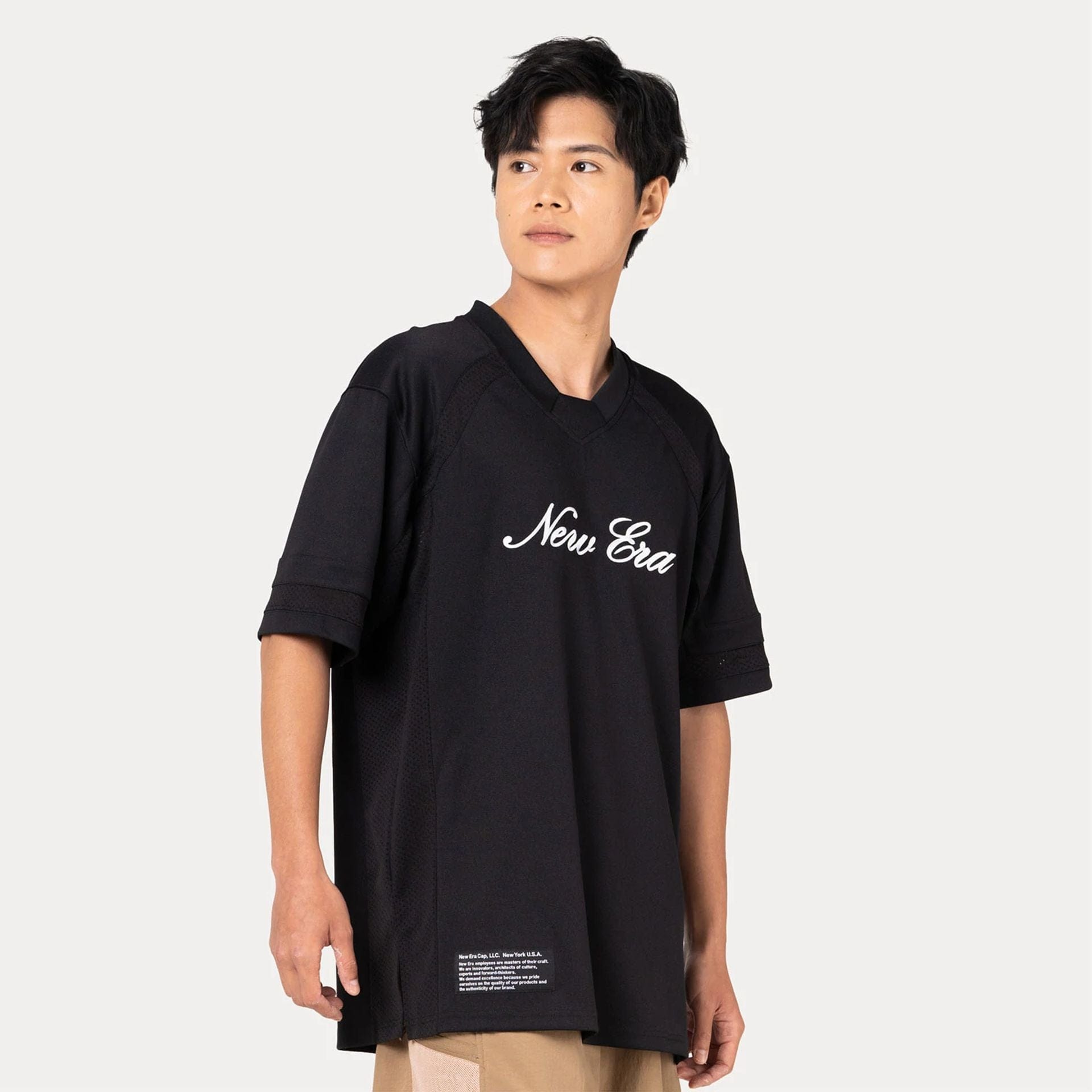 The Male model is wearing New Era Heritage Black Football Jersey 1