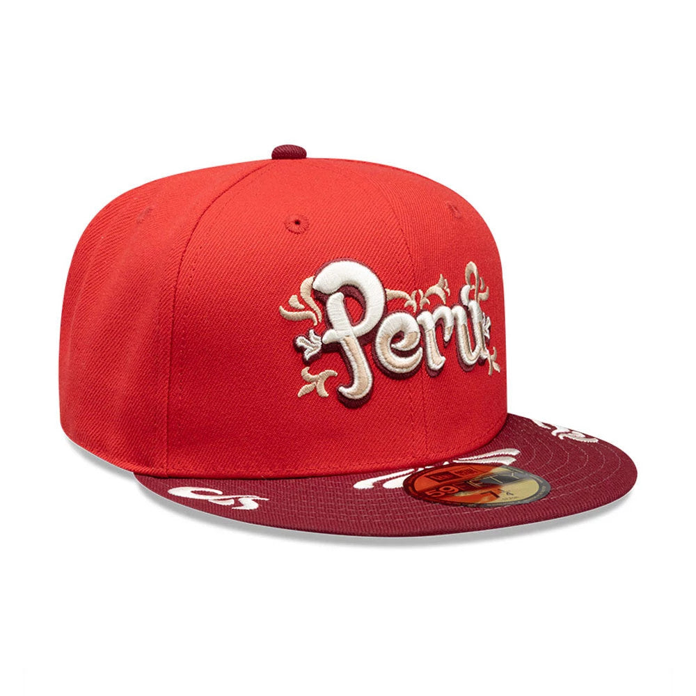 New Era Peru Red 59FIFTY Fitted Cap, three-quarter view with raised white embroidered Peru lettering on the red front panel and a burgundy visor featuring a gold 59FIFTY size sticker on top.