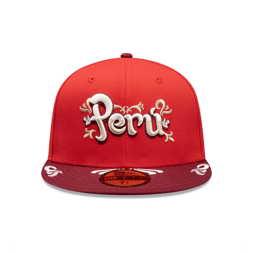 New Era Peru Red 59FIFTY Fitted Cap, front view showing raised white embroidered Peru lettering with decorative flourishes on the red structured crown, and a gold 59FIFTY size sticker on the flat maroon visor.