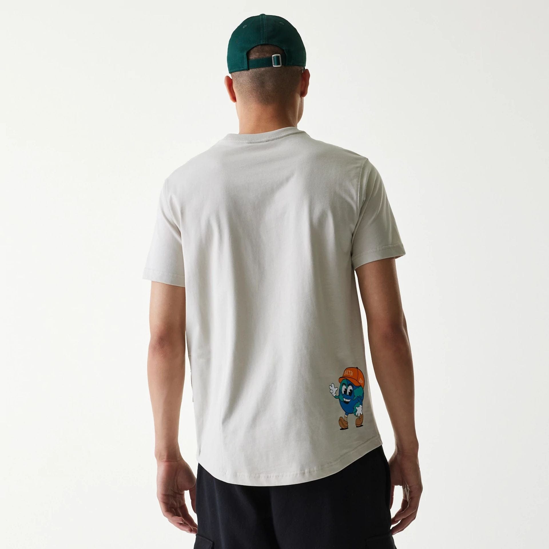 The Male model is wearing New Era Outdoor Earth Day Stone Side Pocket T-Shirt 2