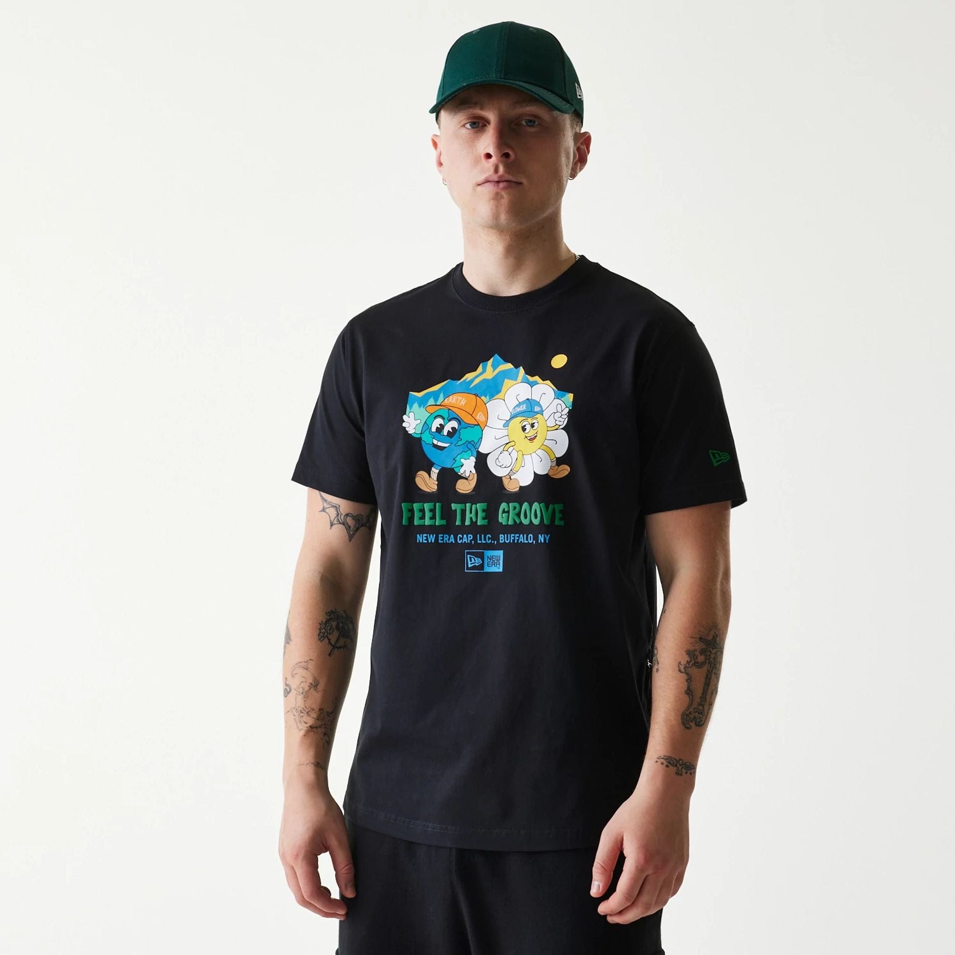 The Male model is wearing New Era Outdoor Earth Day Black T-Shirt 1