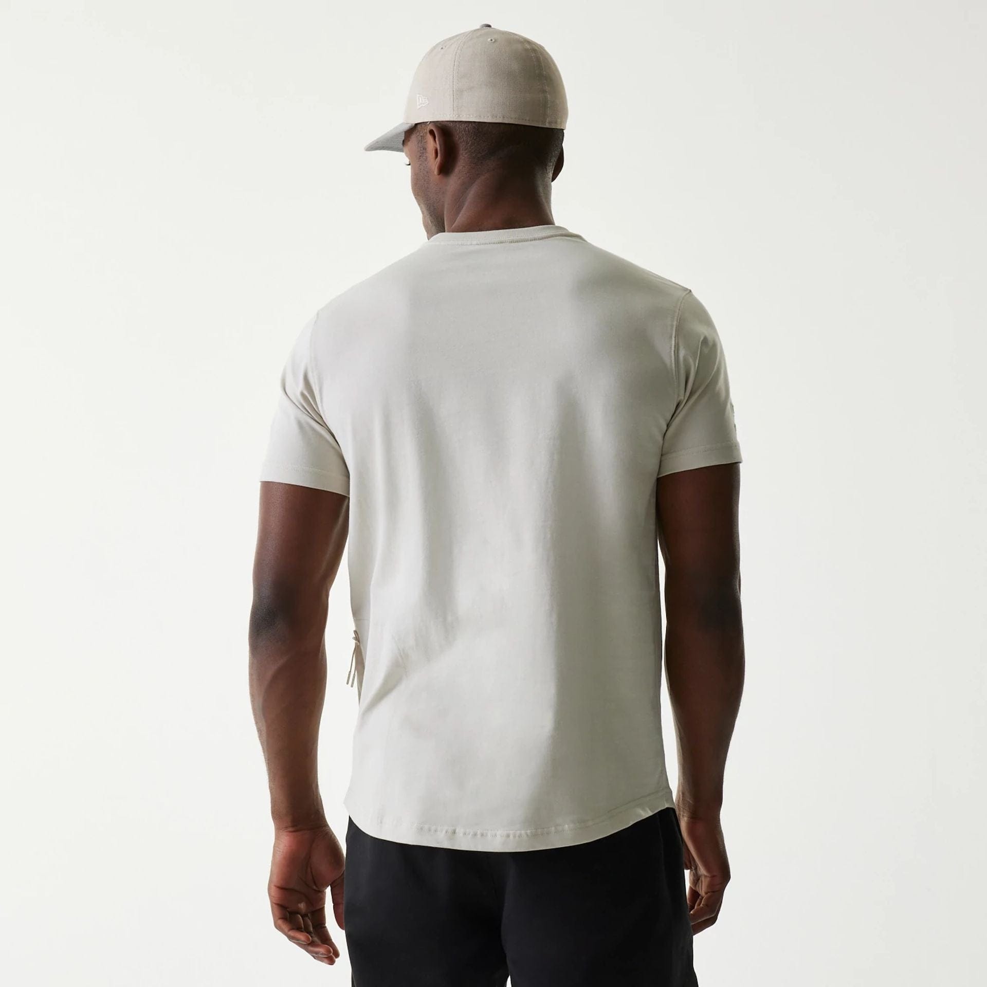 The Male model is wearing New Era Outdoor Earth Day Stone T-Shirt 2