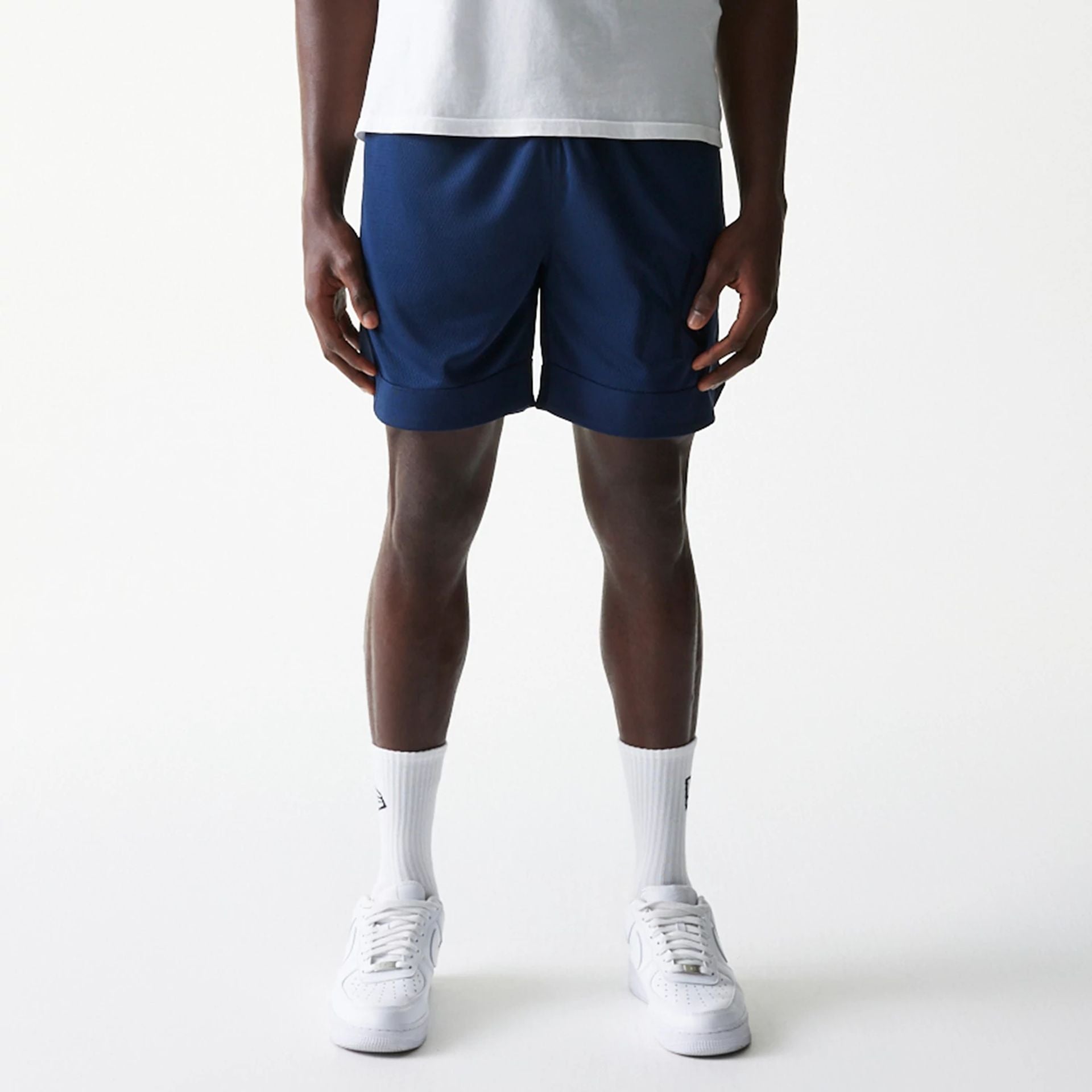 The Male model is wearing New York Yankees Tonal Pack Blue Shorts 1
