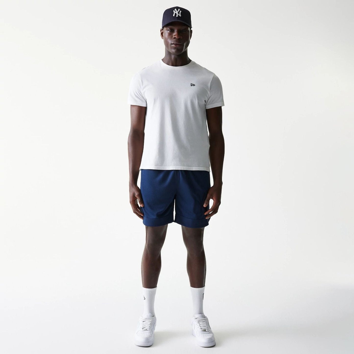 The Male model is wearing New York Yankees Tonal Pack Blue Shorts 8