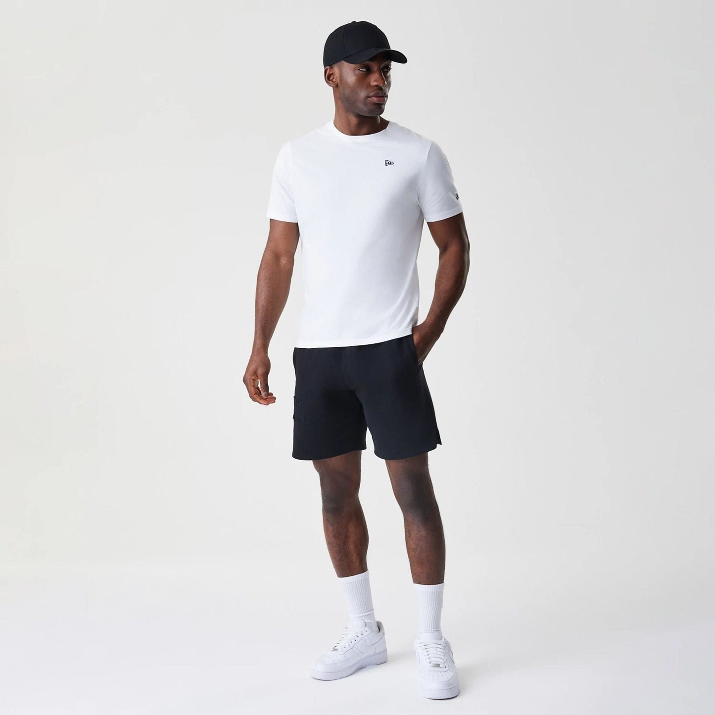 The Male model is wearing New Era Tonal Pack Black Shorts 8
