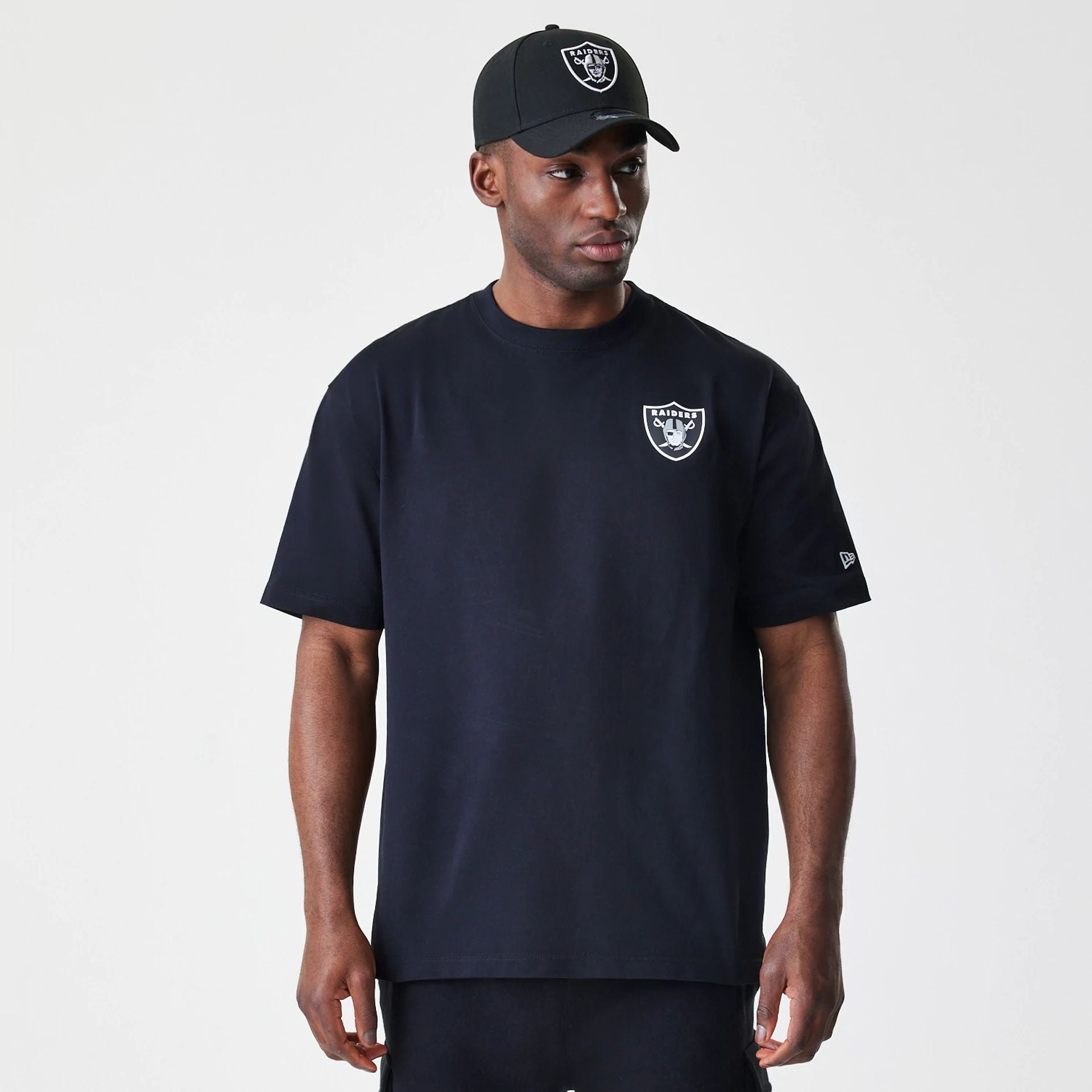 The Male model is wearing Las Vegas Raiders NFL Black Oversized T-Shirt 1