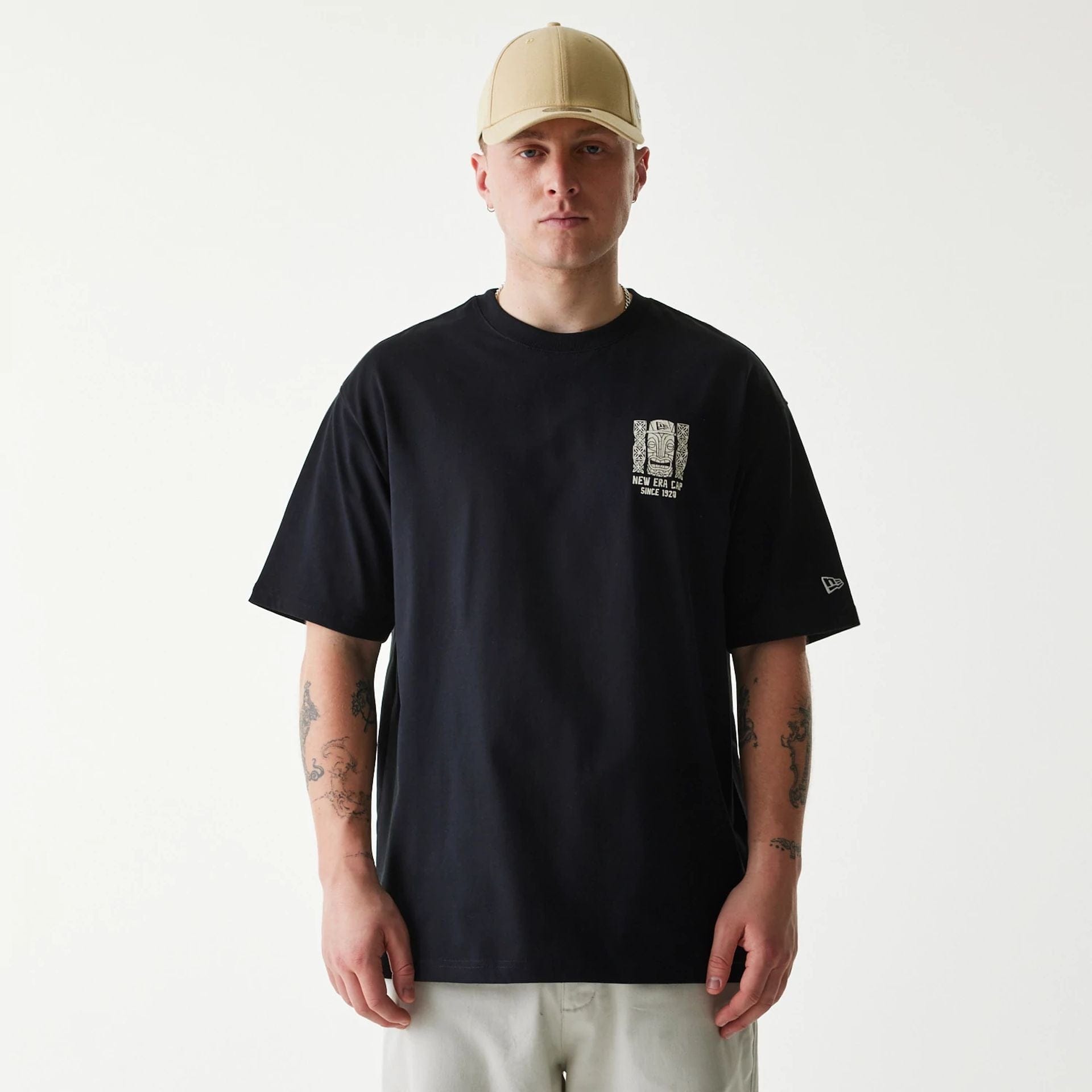 The Male model is wearing New Era Marine Life Club Black Oversized T-Shirt 1