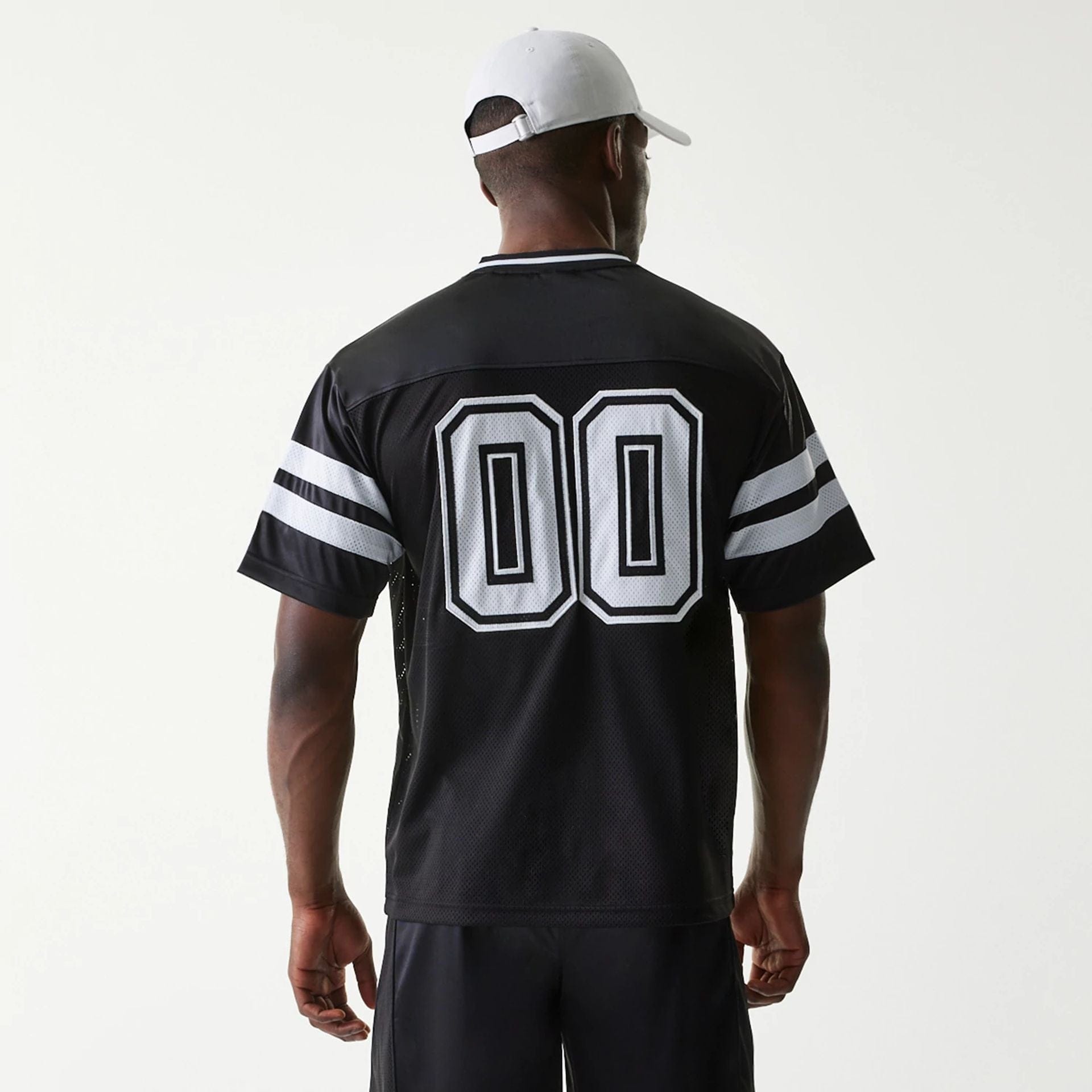 The Male model is wearing New Era Retro Sports Black Mesh Jersey 2