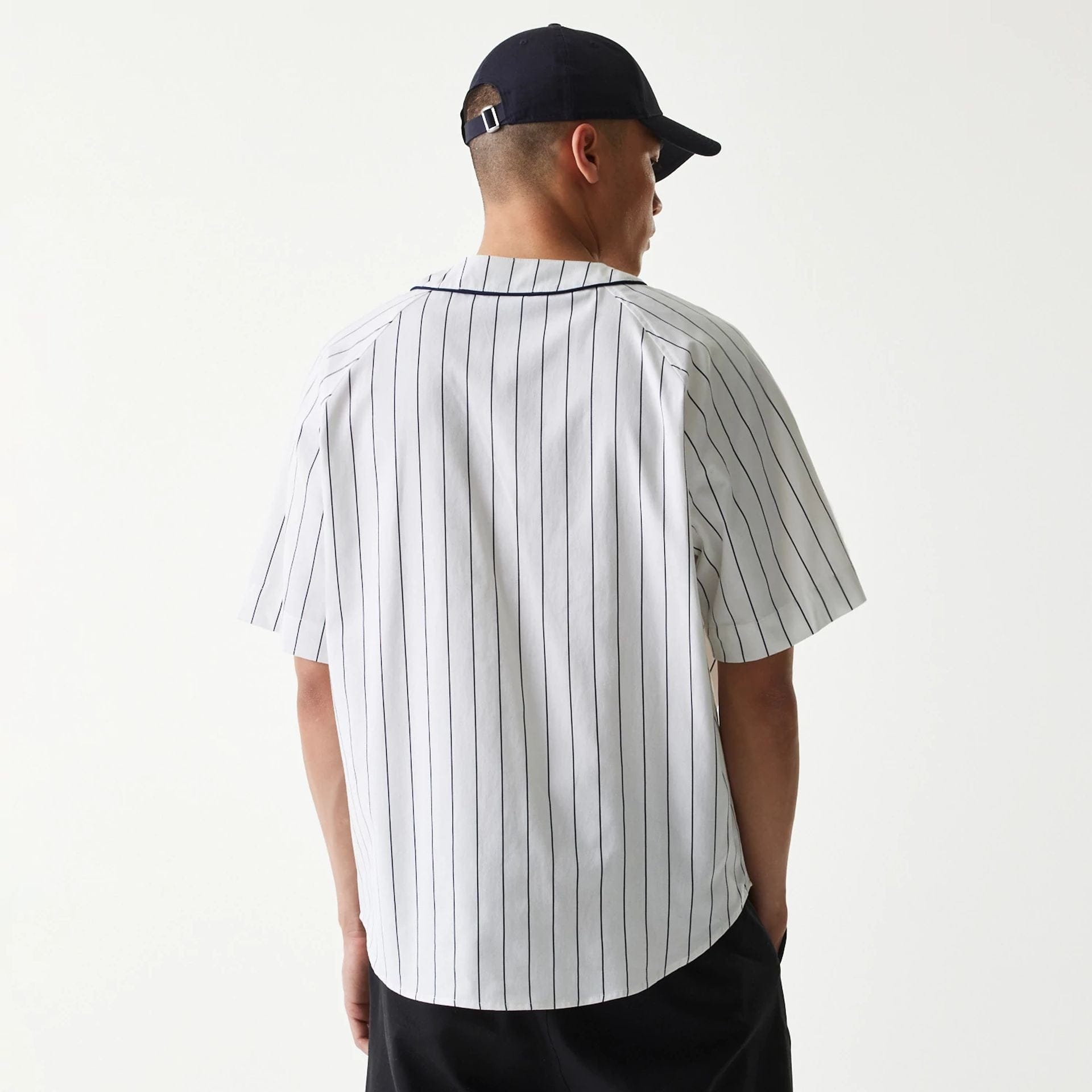 The Male model is wearing New Era Retro Baseball White Short Sleeve Shirt 2
