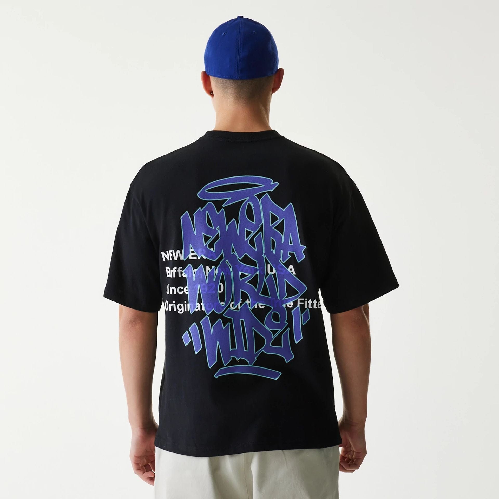 The Male model is wearing New Era Japan Tagging Logo Black T-Shirt 2