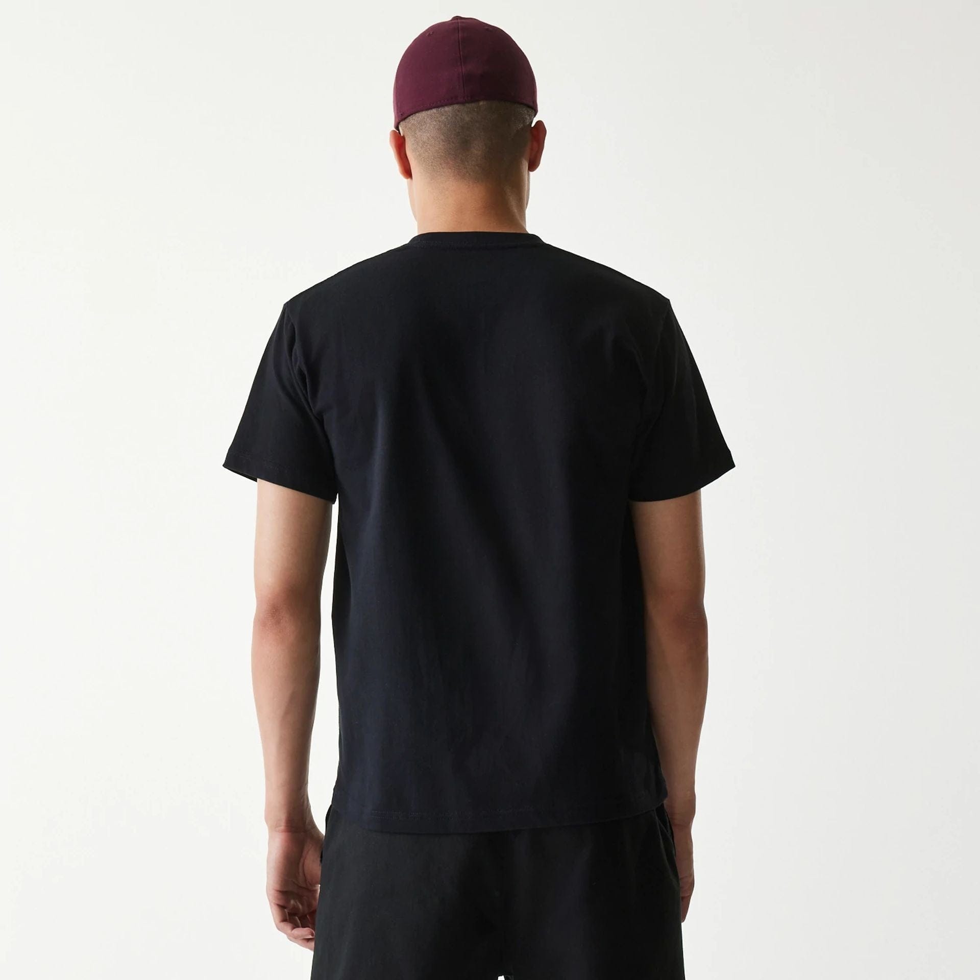 The Male model is wearing New Era Japan Mini Flag Logo Black T-Shirt 2