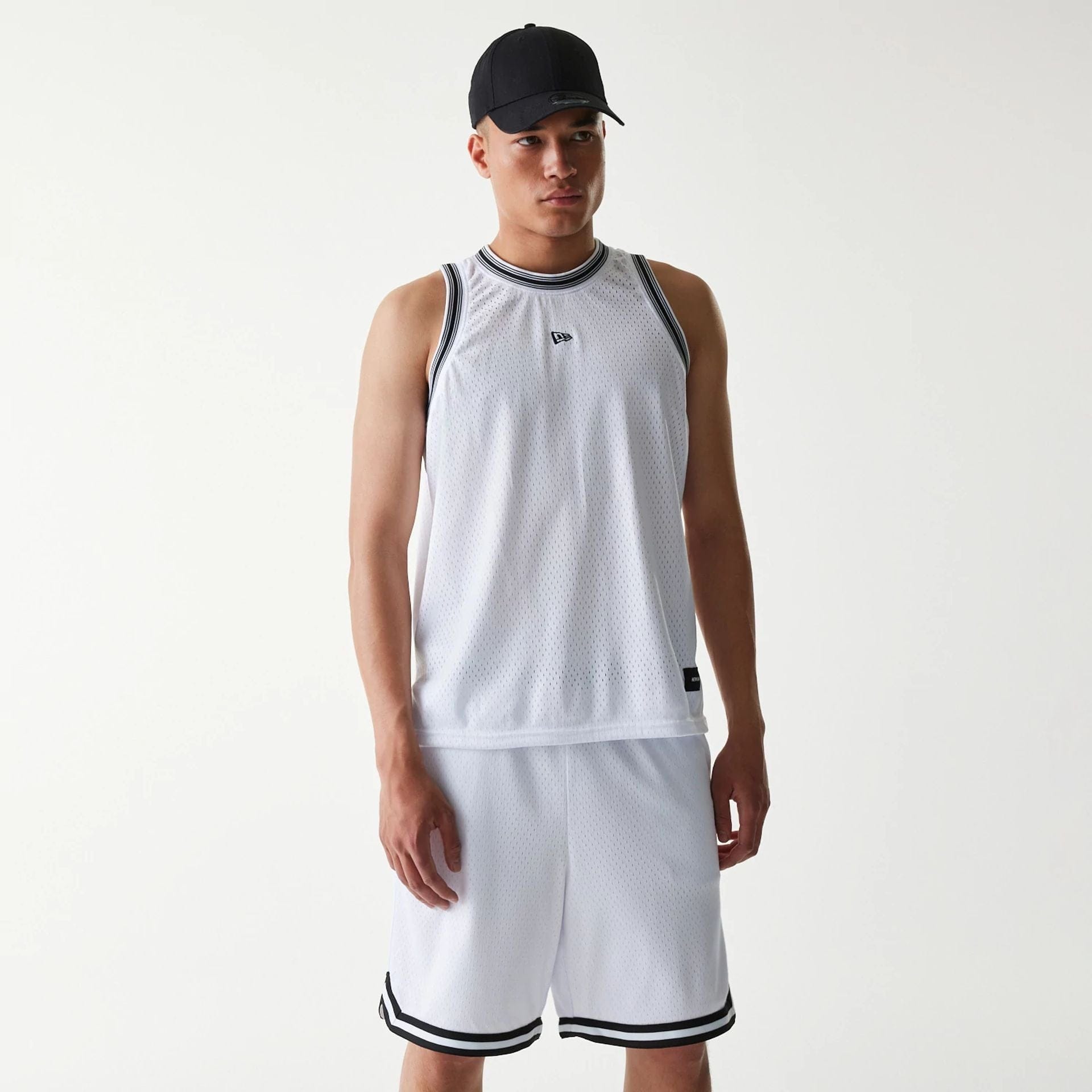 The Male model is wearing New Era Japan Mesh White Sleeveless T-Shirt 1