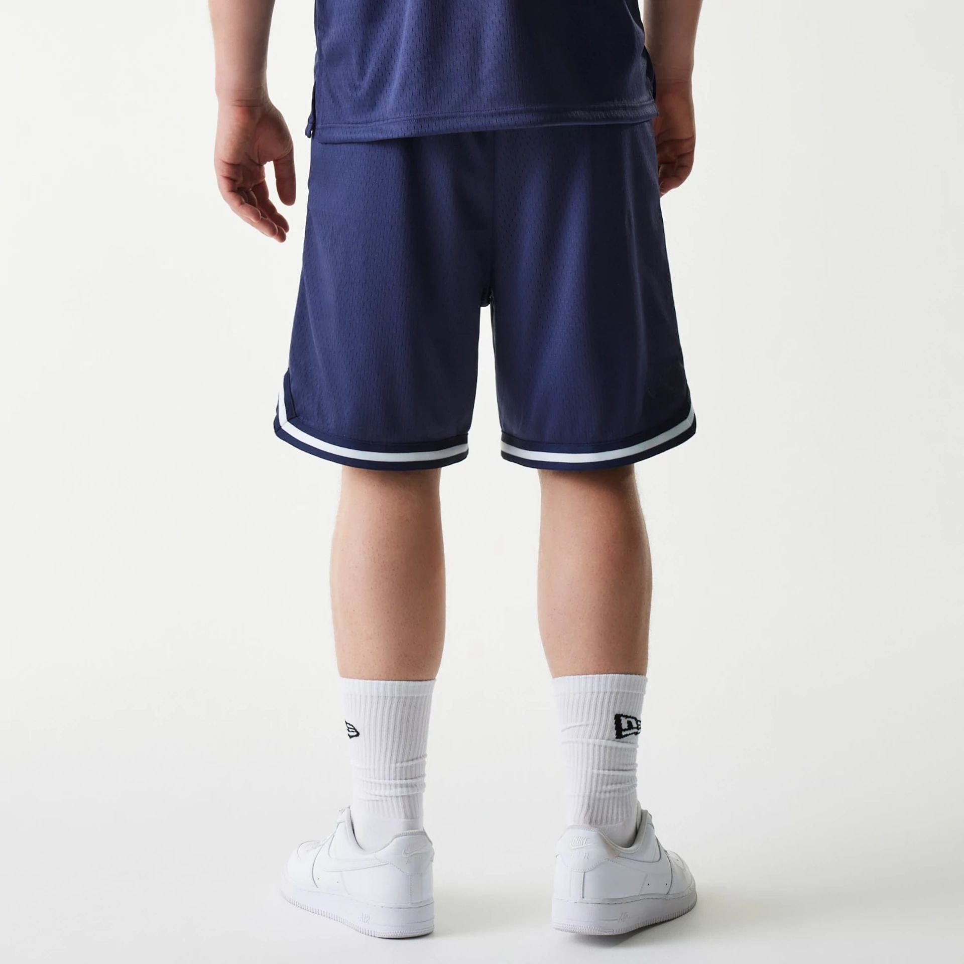 The Male model is wearing New Era Japan Mesh Navy Shorts 2