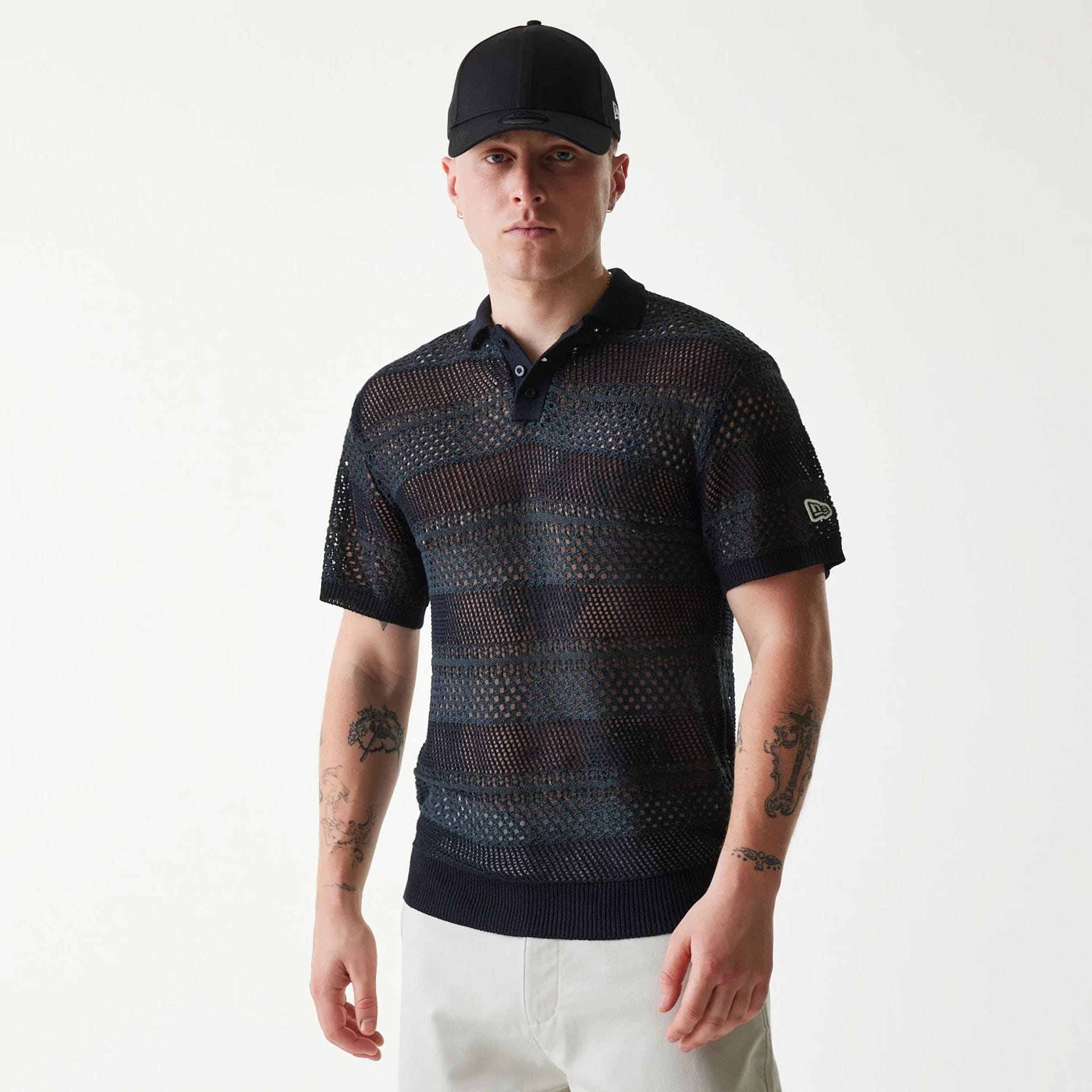 The Male model is wearing New Era Japan Mesh Black Polo T-Shirt 1