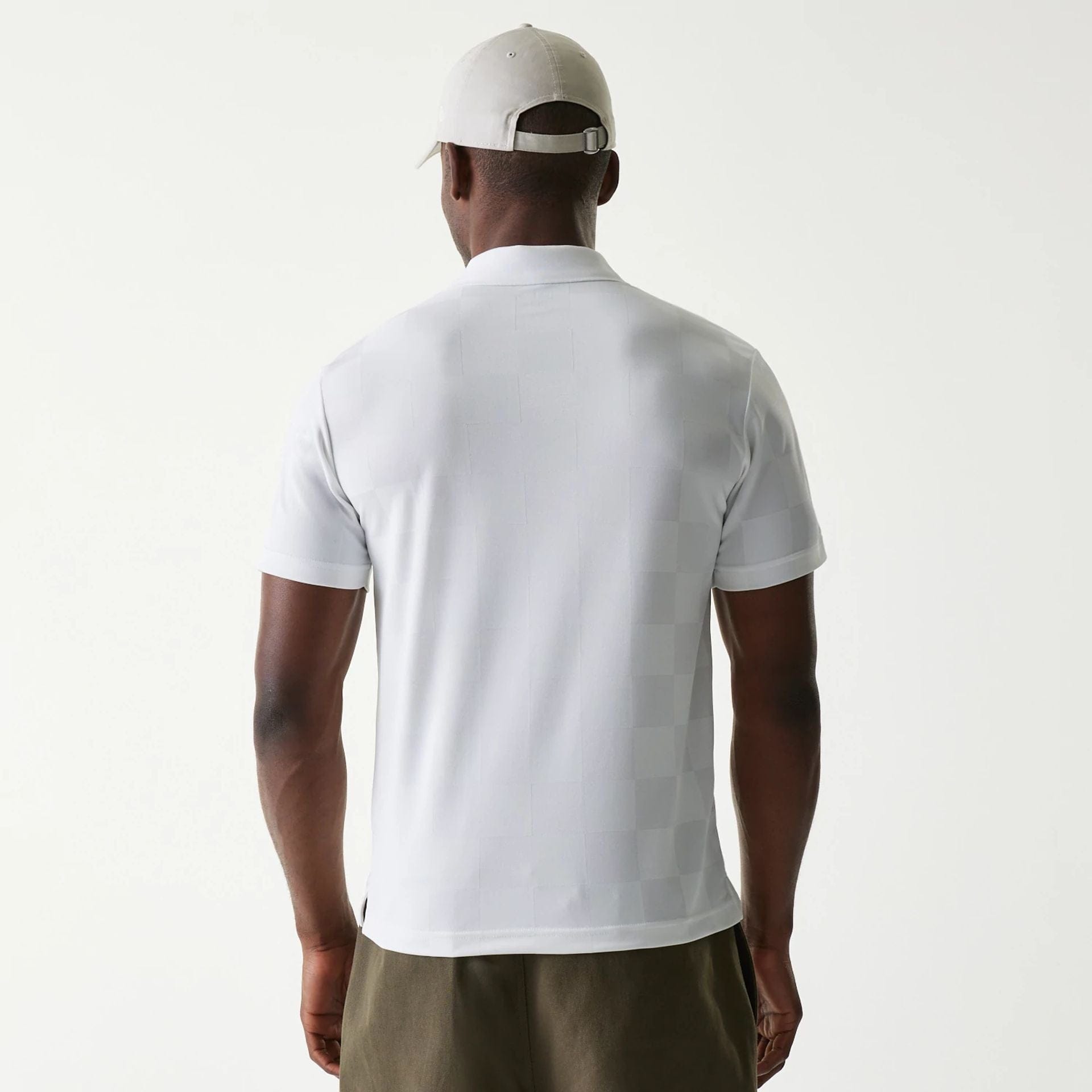 The Male model is wearing New Era Japan Grid White Polo T-Shirt 2