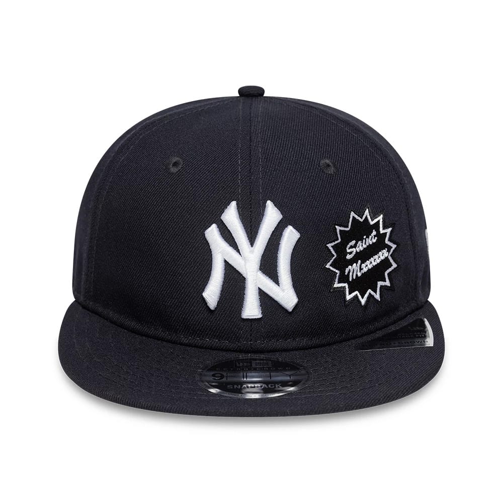 New York Yankees MLB X Saint Mxxxxxx Navy Retro Crown New Era 9FIFTY Snapback Adjustable Cap, front view showing raised white NY logo and starburst Saint Mxxxxxx embroidery on navy fabric, with a 9FIFTY size sticker on the visor.