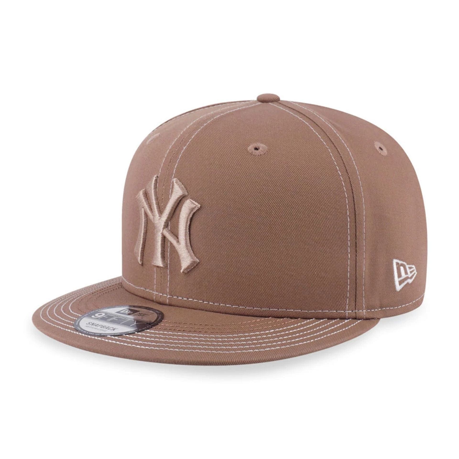 Pictured is this MLB Contrast Stitching New York Yankees 9FIFTY Snapback cap in beige. 1