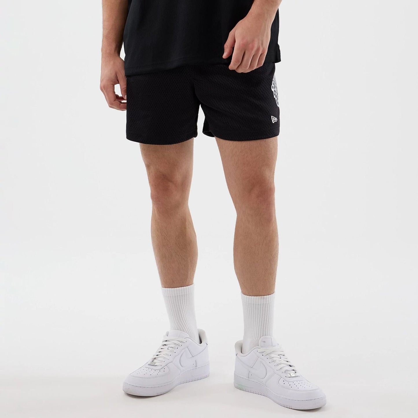 The Male model is wearing LA Kings NHL Street Culture Black Oversized Shorts 7