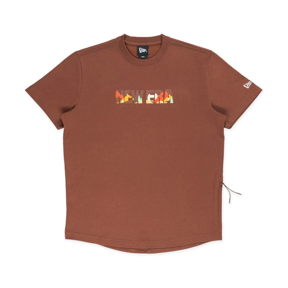 The model is wearing this New Era Mountain Logo T-Shirt in Open Brown. 1