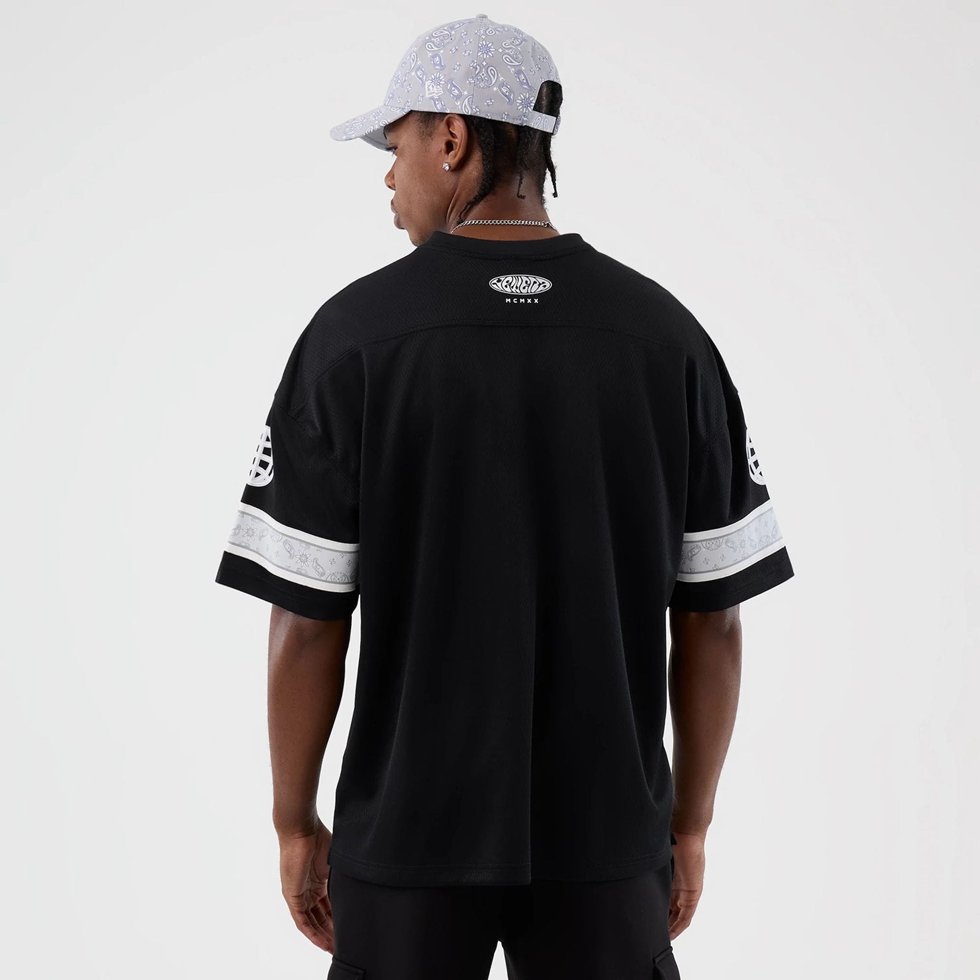 The Male model is wearing New Era Street Swing Black T-Shirt 2