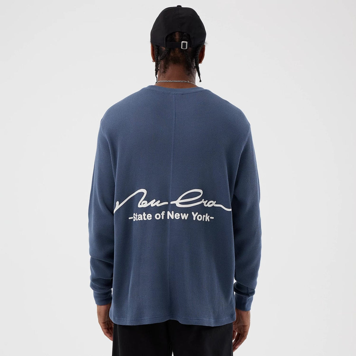 The Male model is wearing New Era Basic Blue Long Sleeve T-Shirt 2