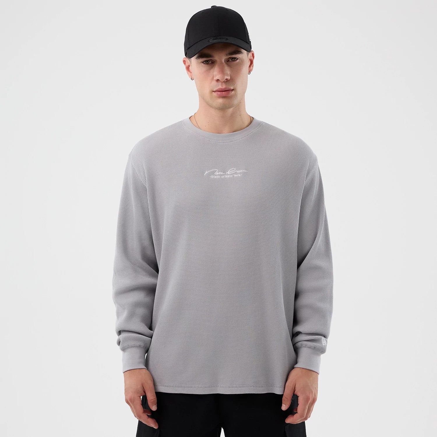 The Male model is wearing New Era Basic Grey Long Sleeve T-Shirt 1