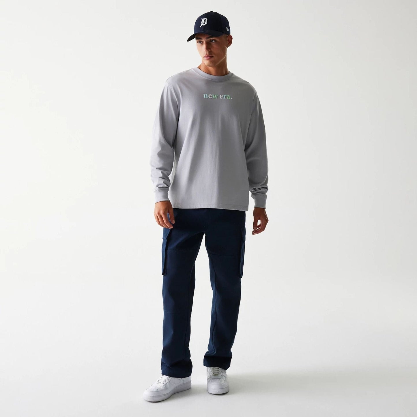 The Male model is wearing New Era 90s Vibe Grey Long Sleeve T-Shirt 3