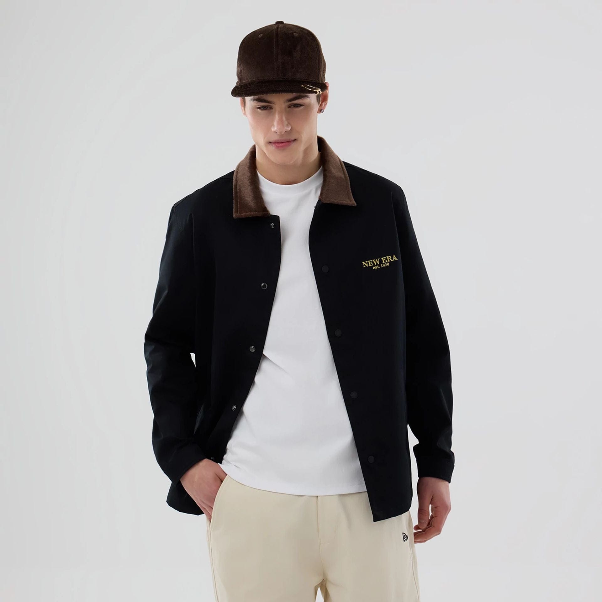 The model is wearing this New Era Year Of The Horse Jacket in black. 1