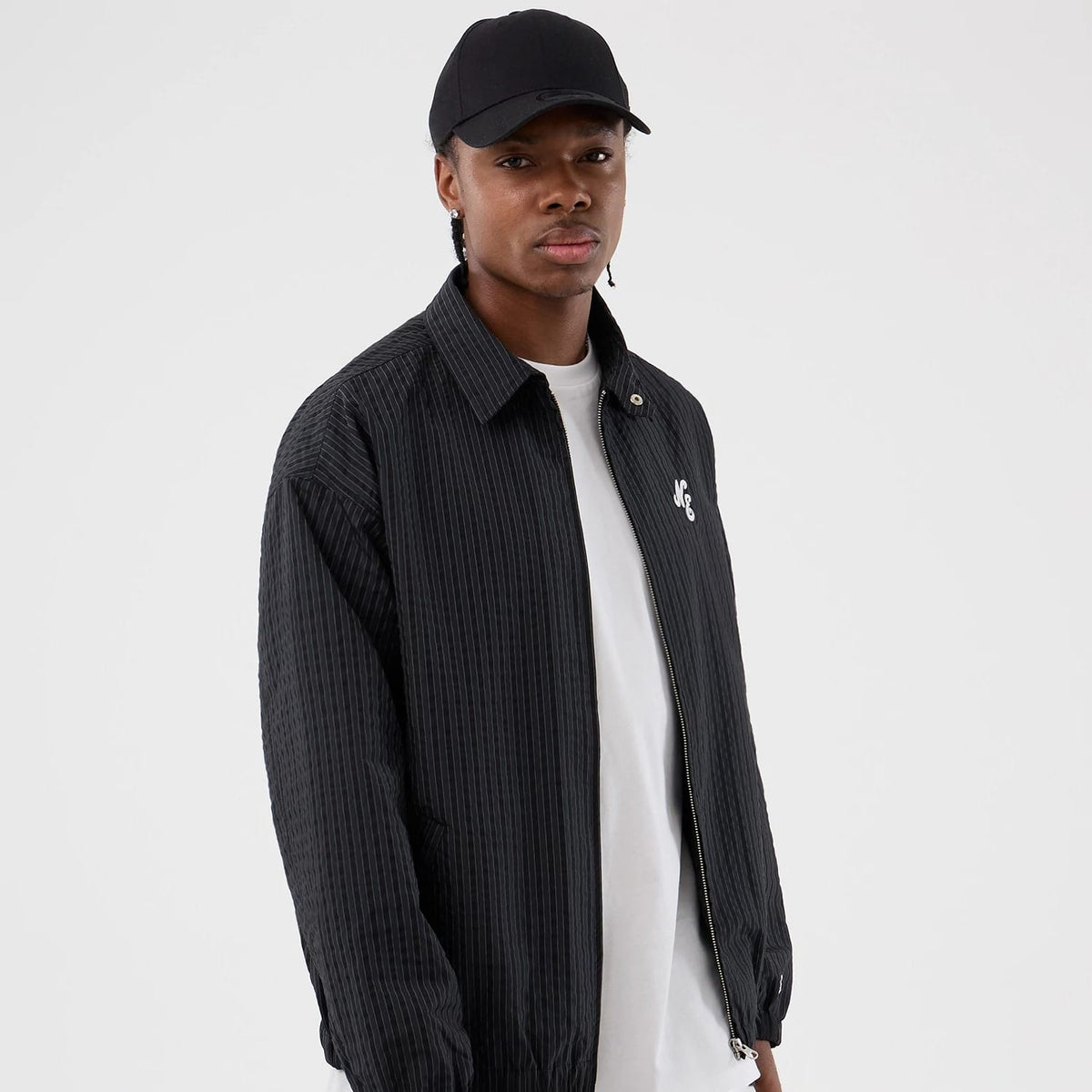 The model is wearing this New Era Street Class jacket in navy. 1