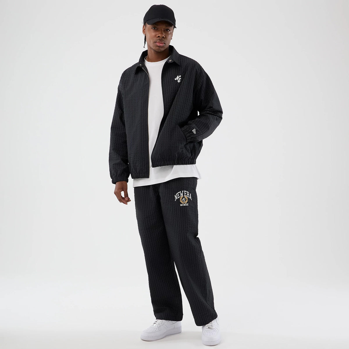 The model is wearing this New Era Street Class jacket in navy. 8