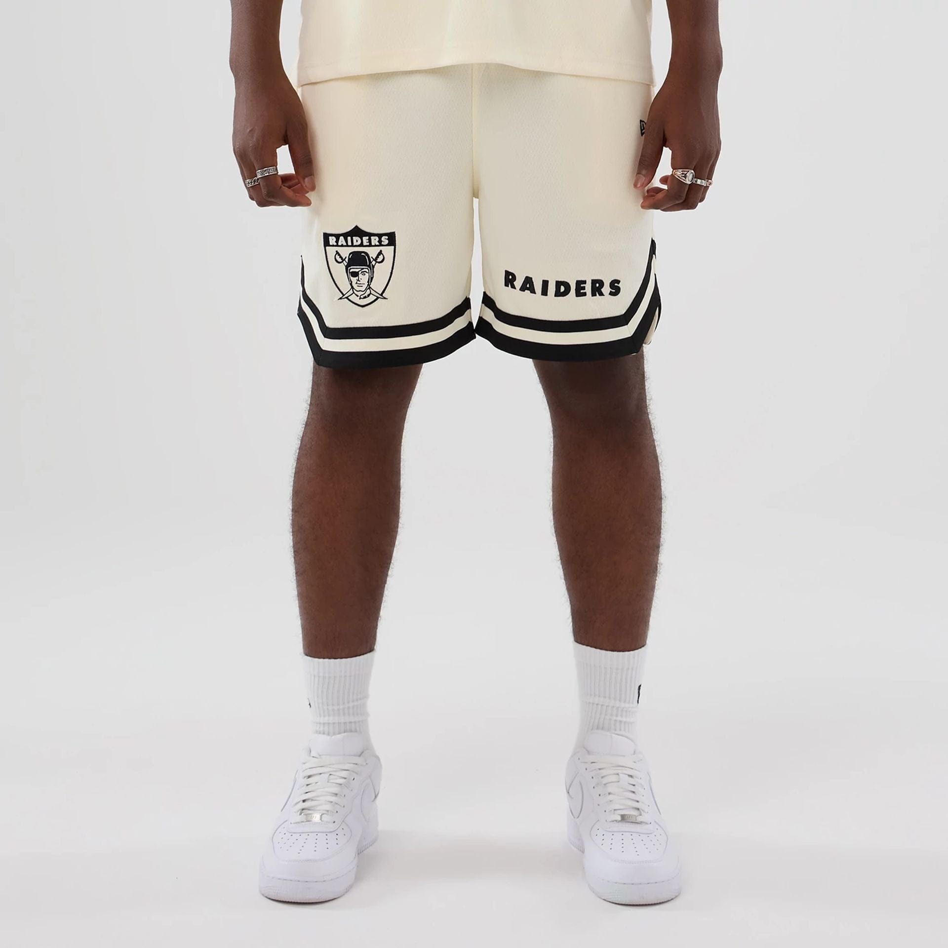 The model is wearing these NFL Historic Las Vegas Raiders shorts in cream. 1