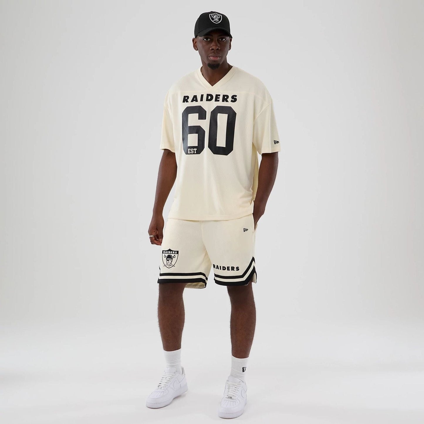 The model is wearing these NFL Historic Las Vegas Raiders shorts in cream. 8