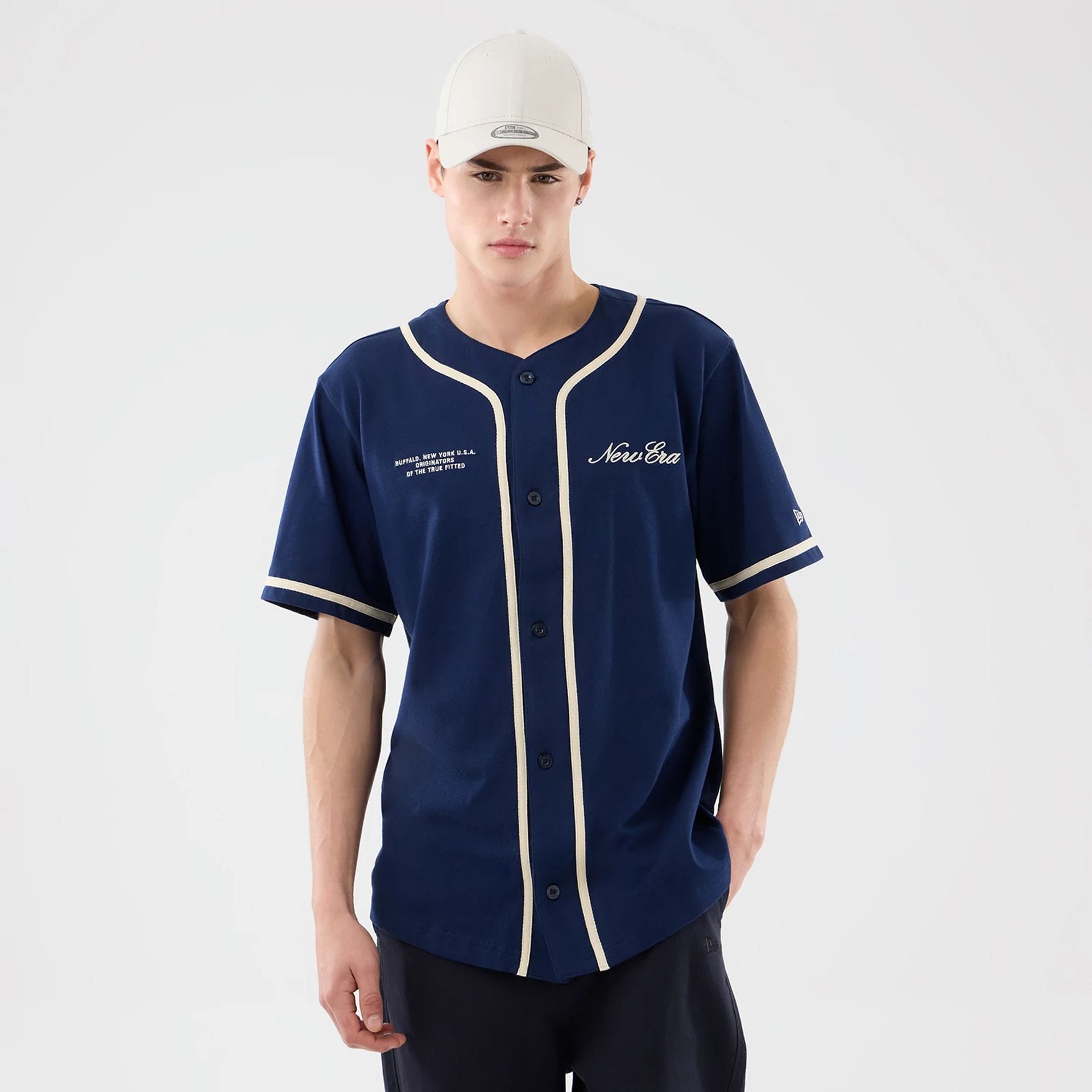 The model is wearing this New Era Oceanside Jersey in blue. 1