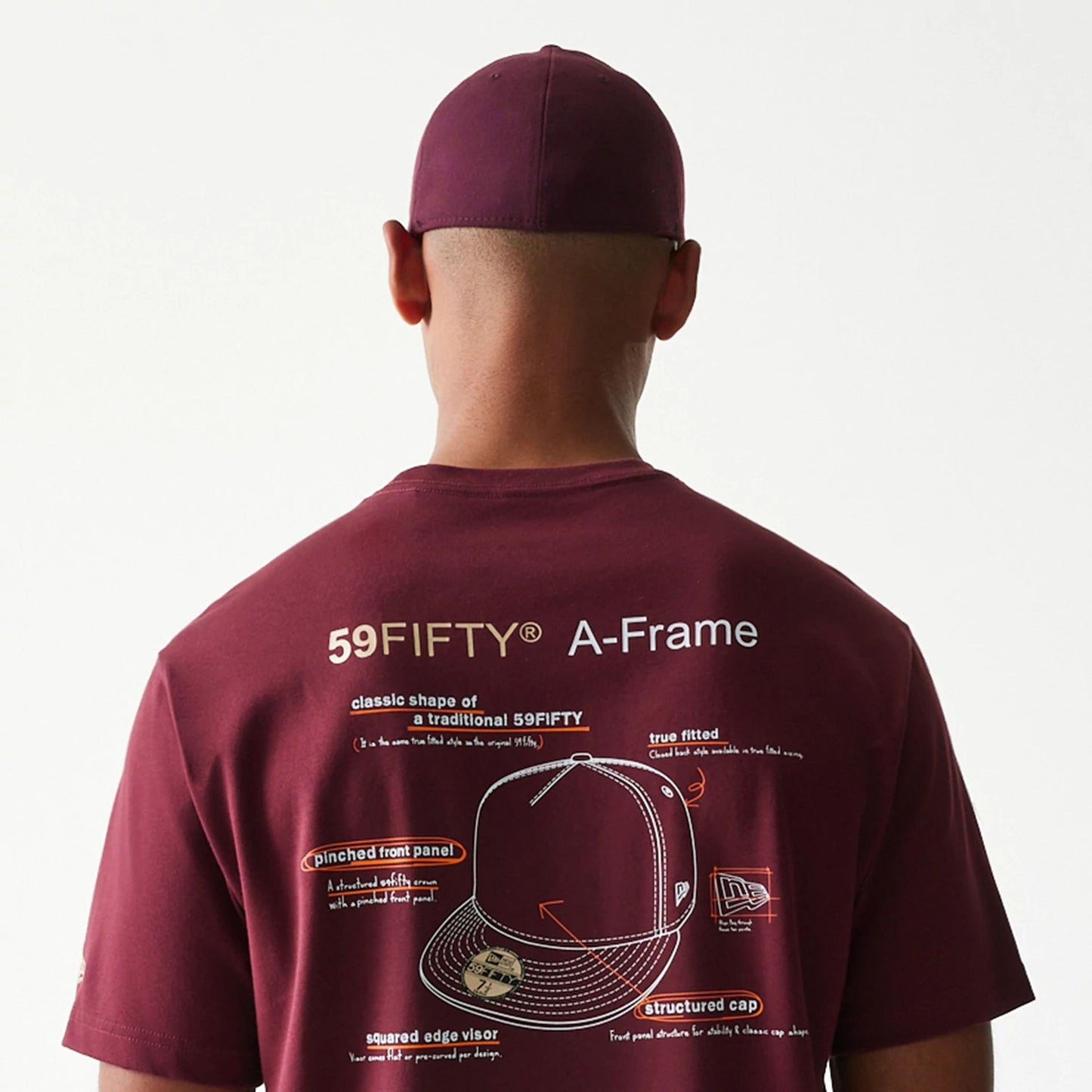 The Male model is wearing A-Frame 59FIFTY Fitted Cap Description Dark Red T-Shirt 7