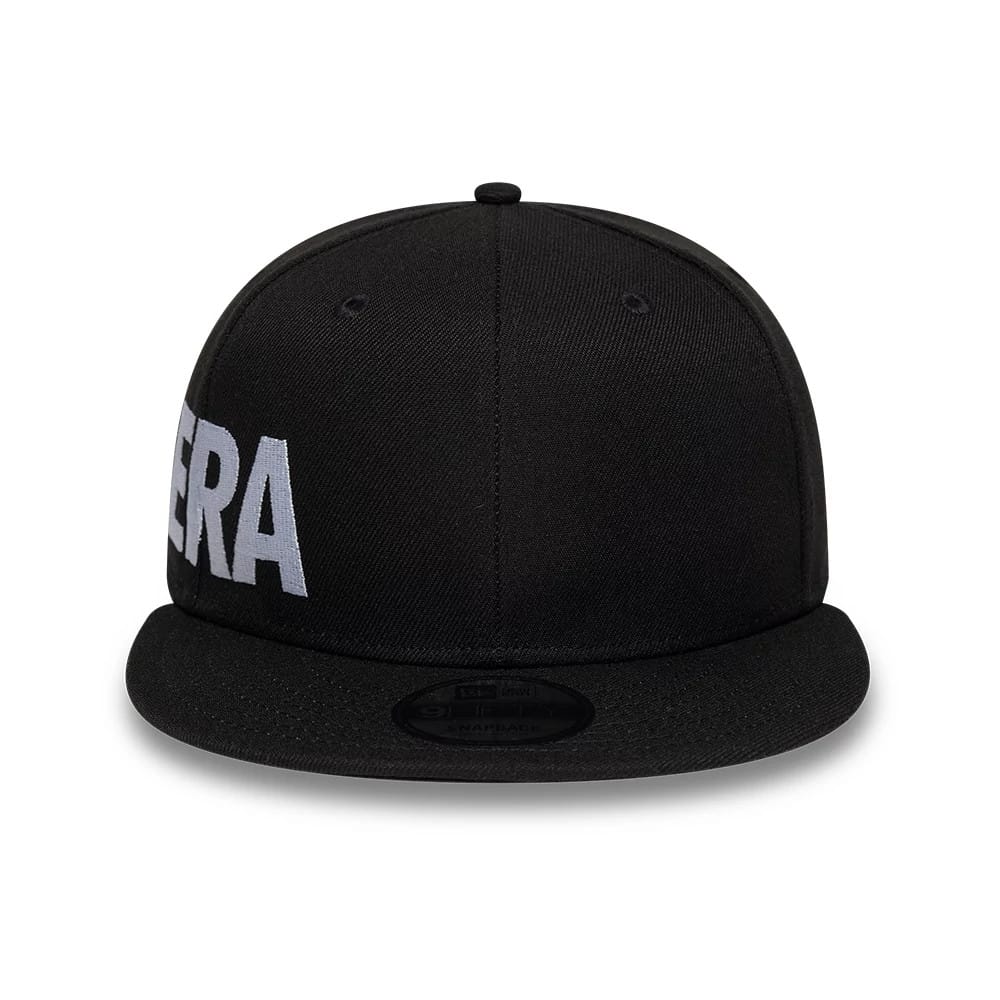 New Era Essential Black 9FIFTY Snapback Adjustable Cap, front view showing large white embroidered letters across the front panels, with a black flat visor and a 9FIFTY size sticker on top.