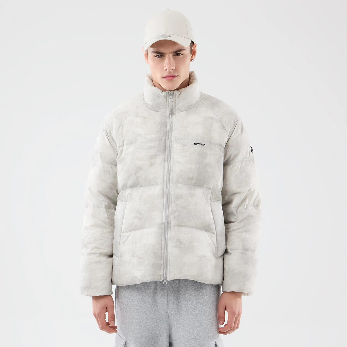 The Male model is wearing New Era Outdoor Natural Down Jacket 1