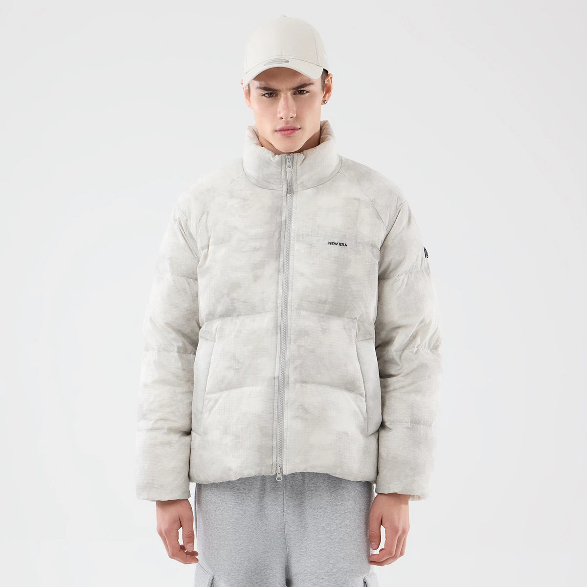 The Male model is wearing New Era Outdoor Natural Down Jacket 1